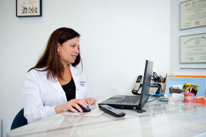 Dr. Khan at her desk