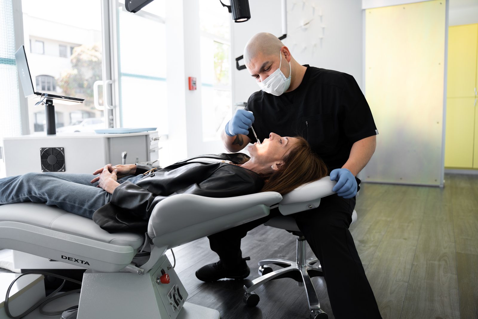 Roger with an adult patient at the chair