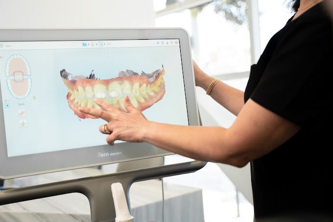 Dr. Khan reviewing a digital scan on the chairside screen